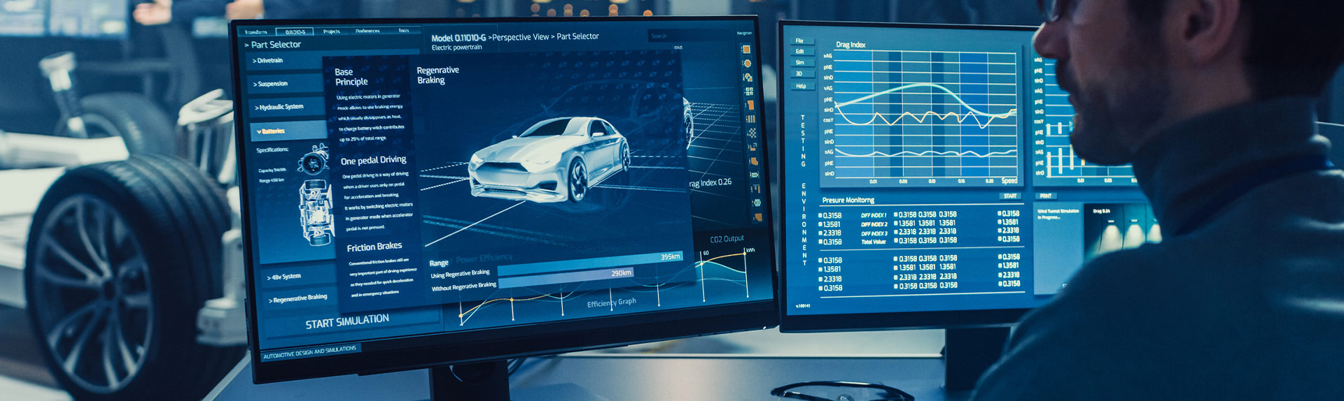 Image of man working at two computer screens designing an automotive braking system.