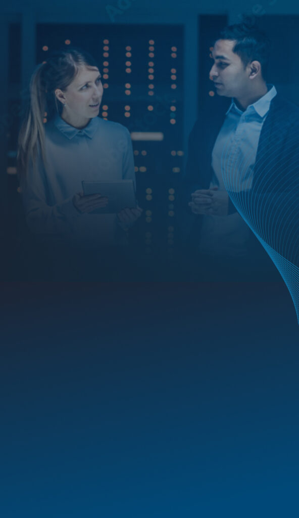Image of banner with blue background with image of man and woman with tablet in hand having a discussion in server room at the top of banner.