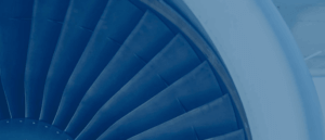 Close up image of airplane jet engine in blue.